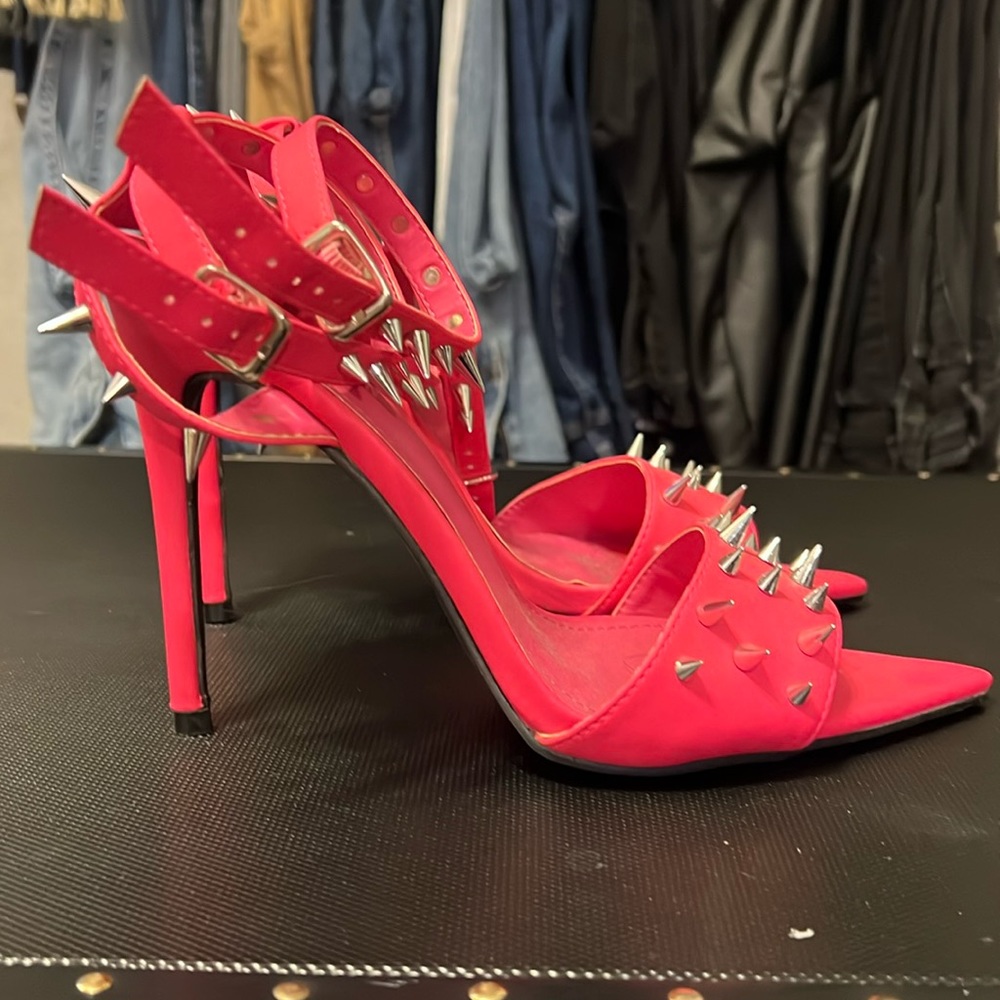 Hot pink spiked pumps double ankle strap